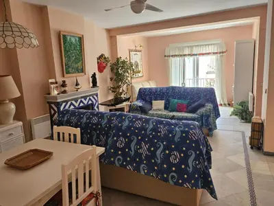 a living room with a couch and a table at Luxury apartment puerto sherry in El Puerto de Santa María