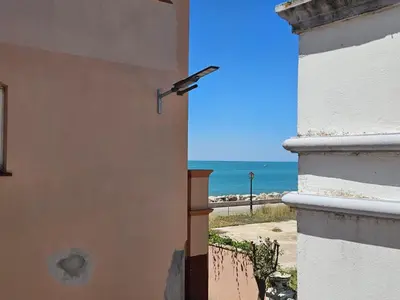 a view of the ocean from a building at Luxury apartment puerto sherry in El Puerto de Santa María