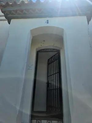 a door with a black gate on the side of a building at Luxury apartment puerto sherry in El Puerto de Santa María
