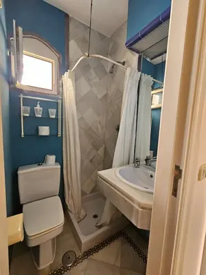 a bathroom with a toilet and a sink at Luxury apartment puerto sherry in El Puerto de Santa María