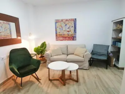 a living room with a couch and two chairs at Apartamento en San Fernando in San Fernando