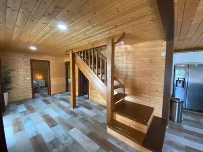 a room with a wooden staircase in a cabin at Chalet Albariza in Sanlúcar de Barrameda
