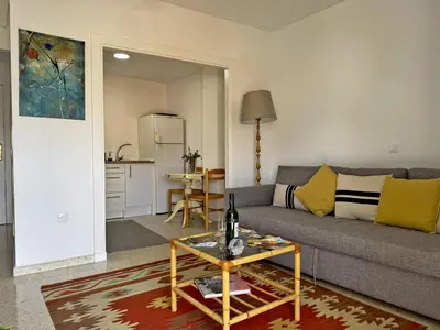 a living room with a couch and a table at Apartamento Sol Jerez - Ole Solutions in Jerez de la Frontera