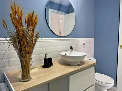 a bathroom with a sink and a mirror at Apartamento Sol Jerez - Ole Solutions in Jerez de la Frontera