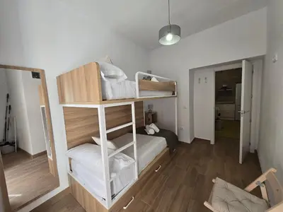 a small room with a bunk bed in it at Allo Apartments Campana Centro 2 Habitaciones in Jerez de la Frontera