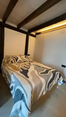 a large bed in a room with at La Cabaña del Lago in Sanlúcar de Barrameda