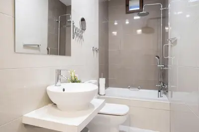 a bathroom with a toilet and a sink and a shower at CDZ - Bella in Cádiz