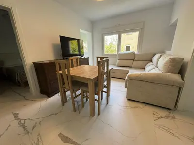 a living room with a table and a couch at Apartamento Santo Tomas Grupo AC Gestion in Cádiz