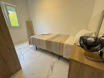 a bedroom with a bed and a window at Apartamento Santo Tomas Grupo AC Gestion in Cádiz