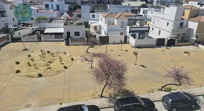 an aerial view of a parking lot in a city at Nao Santiago by Sanlúcar Housing in Sanlúcar de Barrameda