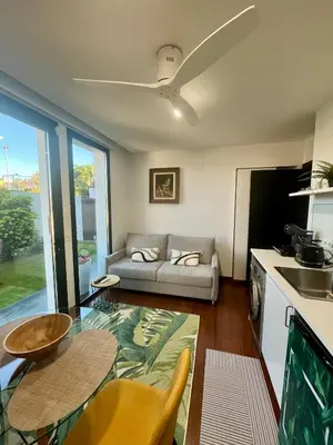 a living room with a couch and a table at Puesta de Sol Doñana Adults Only in Sanlúcar de Barrameda