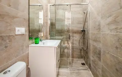 a bathroom with a shower and a sink and a toilet at Nice Home In Jerez De La Frontera in Jerez de la Frontera
