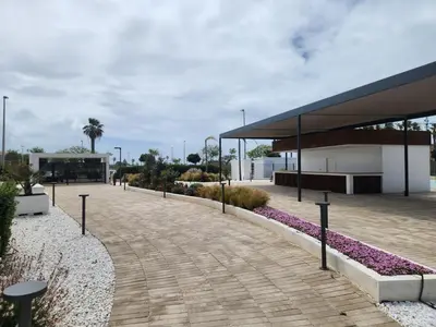 a walkway in front of a building at ELEVENLIGHTS-COSTABALLENA Garden View in Costa Ballena
