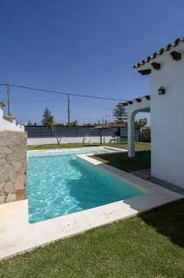 a swimming pool in the yard of a house at Montijo Relax and Sunny Private Pool in Cádiz