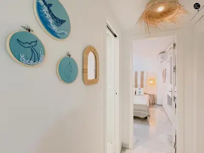 a hallway with blue plates on the wall at Viña Coqueta Grupo AC Gestion in Cádiz
