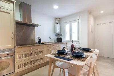 a kitchen with a table with two bowls on it at CDZ - Cristóbal Colón in Cádiz