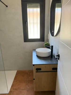 a bathroom with a sink and a mirror at Casita de Mar in Conil de la Frontera