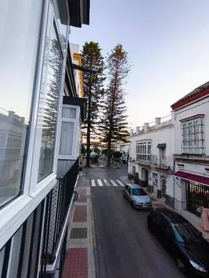 a view of a street from a window of a building at Casa San Juan 55 - Centro Sanlúcar in Sanlúcar de Barrameda