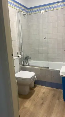 a bathroom with a toilet and a bath tub at FUENTEBRAVIA playa MRZ RENTALS in El Puerto de Santa María