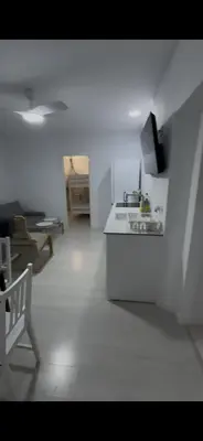 a white kitchen with a sink and a stove at Pleamar Apartamento in El Puerto de Santa María