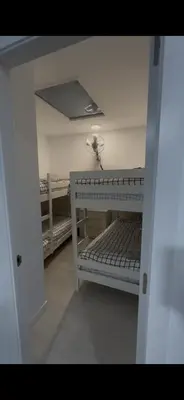 a room with a bunk bed in a room at Pleamar Apartamento in El Puerto de Santa María
