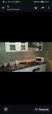 a kitchen with a sink and a stove top oven at Se alquilan habitaciones in Jerez de la Frontera