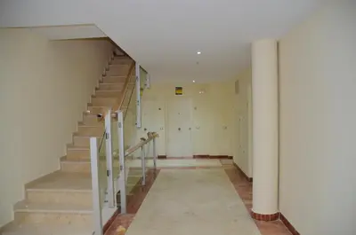 an empty hallway with stairs in a building at El Rincón de la Artista in San Fernando