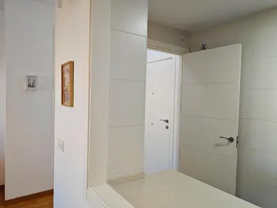 a walk in shower in a bathroom with white walls at El Rincón de la Artista in San Fernando
