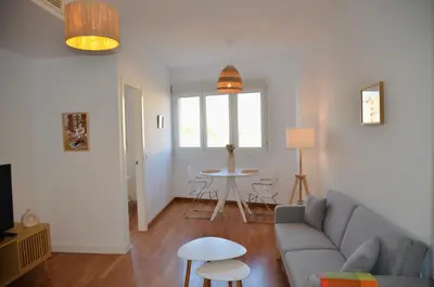 a living room with a couch and a table at El Rincón de la Artista in San Fernando