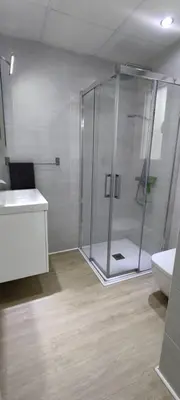 a bathroom with a shower and a toilet and a sink at Countryside villa & private Covered Pool in Chiclana de la Frontera