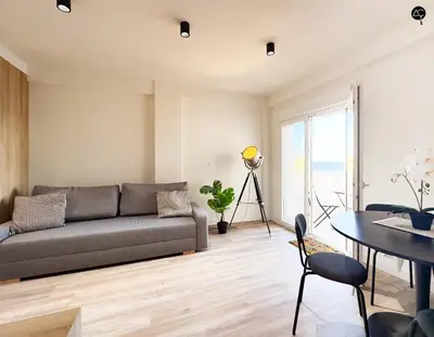 a living room with a couch and a table at En la Orilla del Mar Grupo AC Gestion in Cádiz