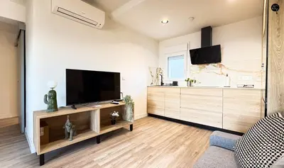a living room with a flat screen tv on a wall at En la Orilla del Mar Grupo AC Gestion in Cádiz