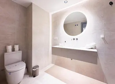 a bathroom with a sink and a mirror at En la Orilla del Mar Grupo AC Gestion in Cádiz