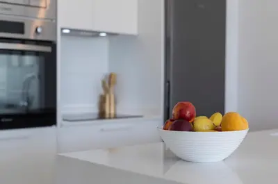 a bowl of fruit on a counter in a kitchen at Ocean Costa Ballena in Chipiona