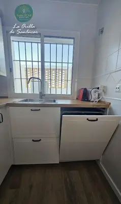a kitchen with a sink and a window at La Orilla by Sanlucar Housing in Sanlúcar de Barrameda