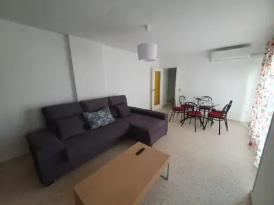 a living room with a couch and a table at Timonel Arenas in El Puerto de Santa María