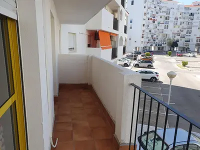 a balcony of a building with a staircase and a street at Timonel Arenas in El Puerto de Santa María