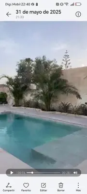 a picture of a swimming pool with trees in the background at Casa Isabel 29 in Chipiona