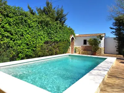 a swimming pool in the backyard of a villa at Villa El Cortijo Andaluz in Cádiz