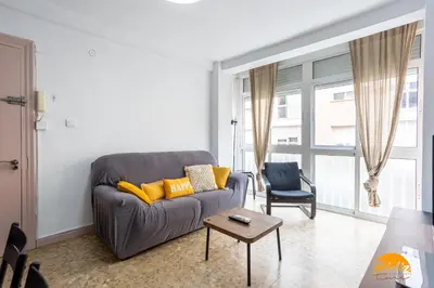 a living room with a couch and a table at Teresa Uno by Cadiz Time in Cádiz