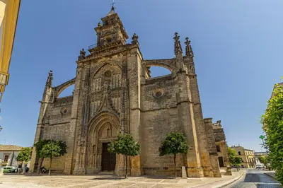 an old stone church with trees in front of it at Allo Apartments Merced Duplex Centro 2 habitaciones - 2 Baños in Jerez de la Frontera