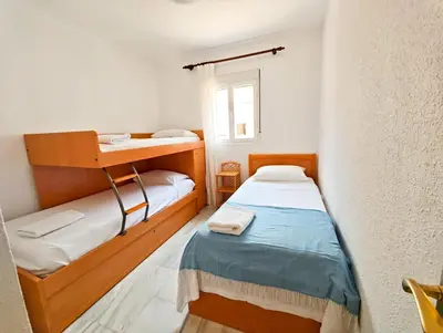 a small room with a bunk bed and a window at Primera Linea Costa Ballena con Vista al Mar in Costa Ballena