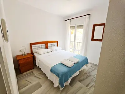 a bedroom with a bed with two towels on it at Primera Linea Costa Ballena con Vista al Mar in Costa Ballena