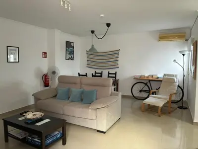 a living room with a couch and a table at Casa del Oratorio 1812 in Cádiz
