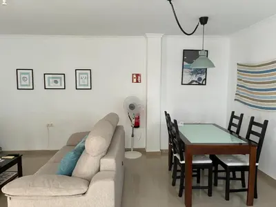 a living room with a couch and a table at Casa del Oratorio 1812 in Cádiz