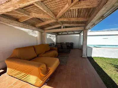 a living room with a couch under a wooden ceiling at Apartoyou - Puerto Paradise in Inmaculada