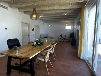 a dining room with a wooden table and chairs at Apartoyou - Puerto Paradise in Inmaculada