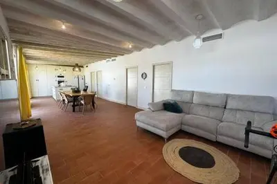 a large living room with a couch and a table at Apartoyou - Puerto Paradise in Inmaculada
