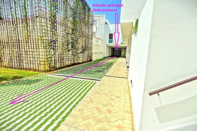 an empty street with a building and pink lines at Jacuzzi & Pool House w Rooftop Terrace, Garden BBQ in El Puerto de Santa María