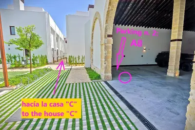 a view of a building with a garage at Jacuzzi & Pool House w Rooftop Terrace, Garden BBQ in El Puerto de Santa María